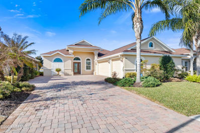 Palm Coast, FL home for sale located at 100 Arena Lake Dr, Palm Coast, FL 32137